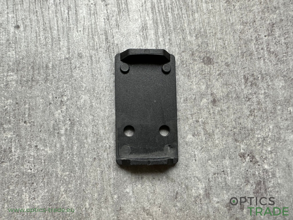 Adapter plate with a raised section on both sides